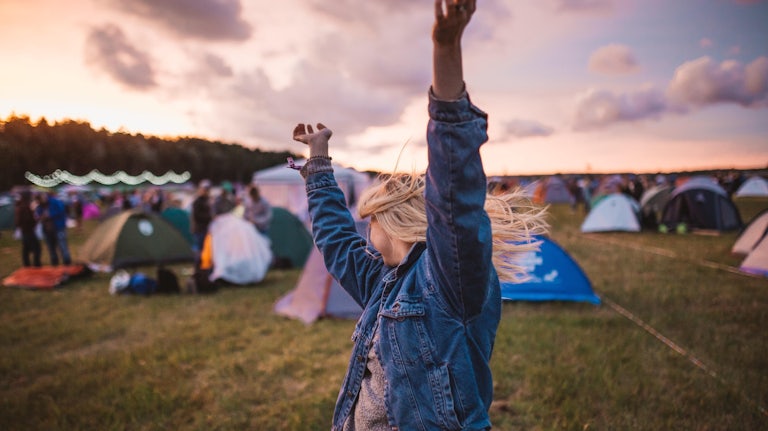 woman-festival-tents-field